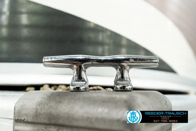 Slide: The Image of Chrome cleat on a 2003 Bennington 2050 RL boat, close-up view. - 46