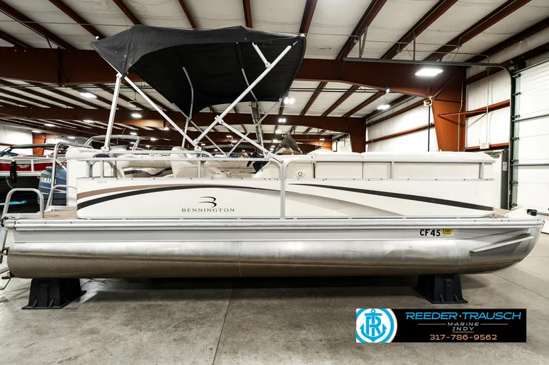 Slide: The Image of 2003 Bennington 2050 RL pontoon boat in indoor storage facility. - 7