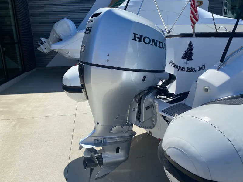 Slide: The Image of Walker Bay Generation 525 DLX 2021 with Honda outboard motor, docked at Presque Isle, MI. - 11