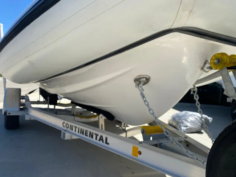 Slide: The Image of 2021 Walker Bay Generation 525 DLX boat on Continental trailer, close-up view. - 16
