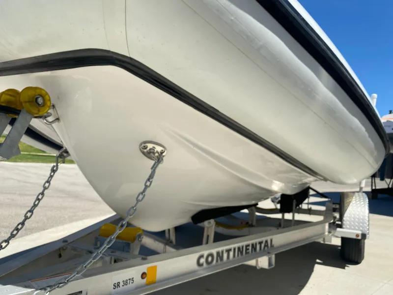 Slide: The Image of 2021 Walker Bay Generation 525 DLX boat on Continental trailer, side view. - 17