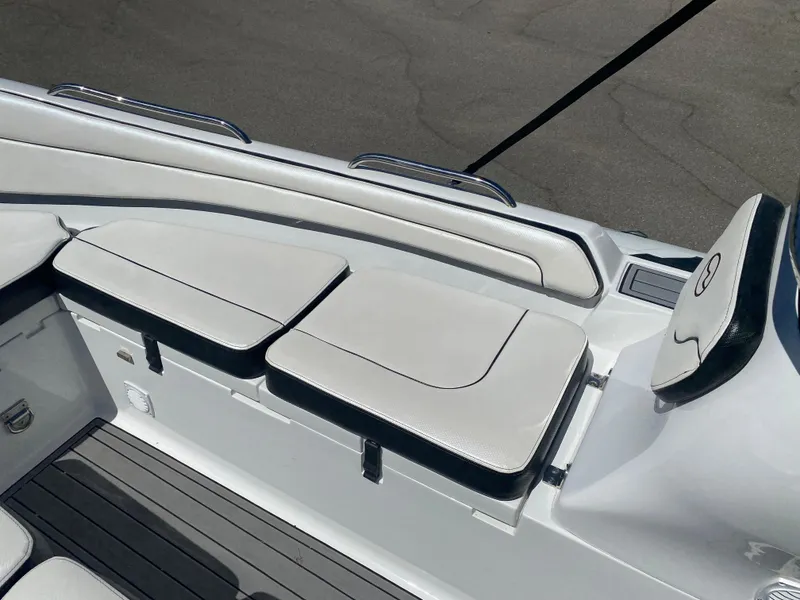 Slide: The Image of 2021 Walker Bay Generation 525 DLX boat interior with cushioned seating and sleek design. - 24