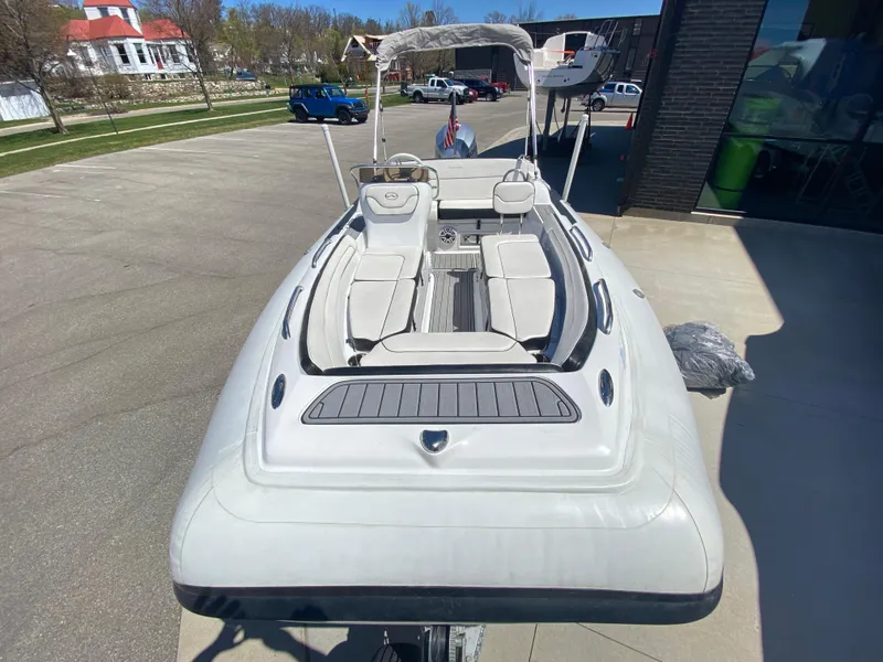 Slide: The Image of 2021 Walker Bay Generation 525 DLX boat on trailer, parked outdoors. - 3