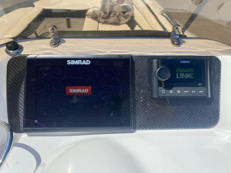 Slide: The Image of Simrad and Fusion Link displays on 2021 Walker Bay Generation 525 DLX boat dashboard. - 30