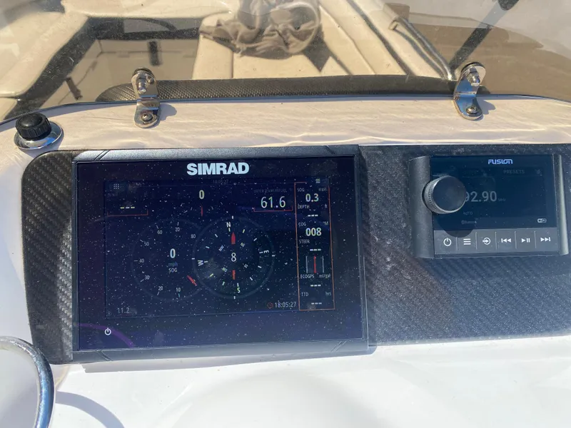 Slide: The Image of Simrad and Fusion displays on 2021 Walker Bay Generation 525 DLX boat dashboard. - 31