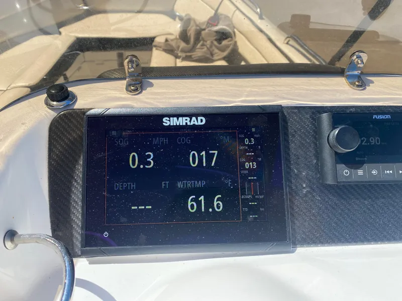 Slide: The Image of Simrad display on 2021 Walker Bay Generation 525 DLX showing speed, course, and water temperature. - 32