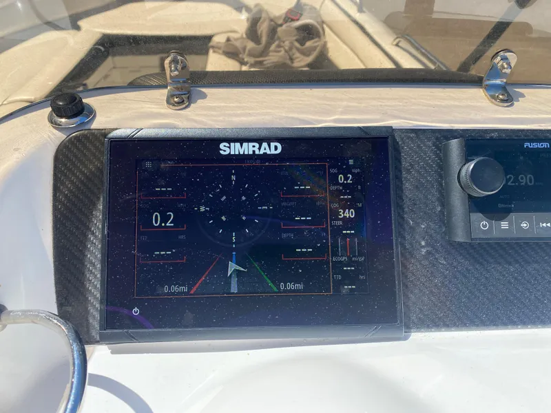 Slide: The Image of Simrad navigation display on 2021 Walker Bay Generation 525 DLX boat dashboard. - 33