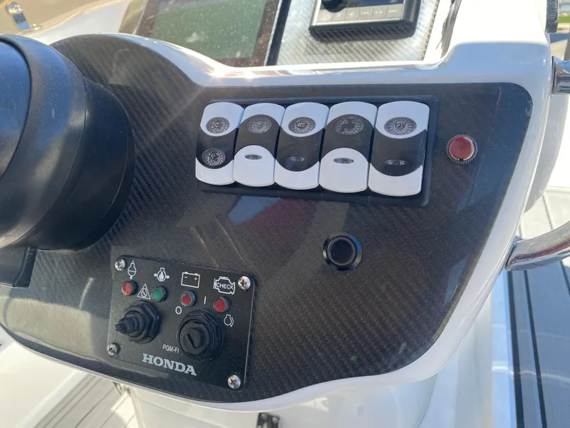 Slide: The Image of Control panel of 2021 Walker Bay Generation 525 DLX boat with Honda components. - 36