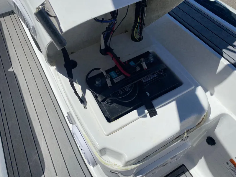 Slide: The Image of 2021 Walker Bay Generation 525 DLX boat battery compartment with open hatch. - 37