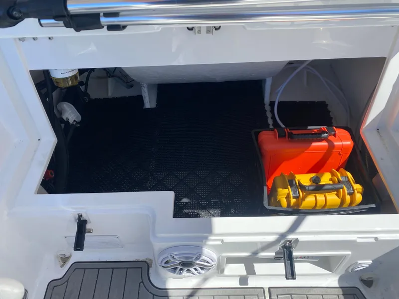 Slide: The Image of 2021 Walker Bay Generation 525 DLX storage compartment with safety equipment and accessories. - 38