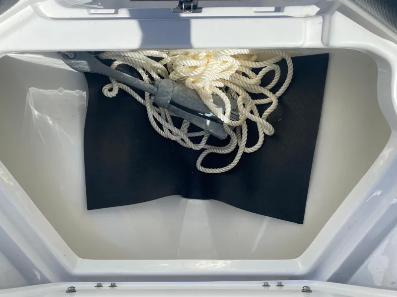 Slide: The Image of Anchor and rope storage in 2021 Walker Bay Generation 525 DLX boat compartment. - 43