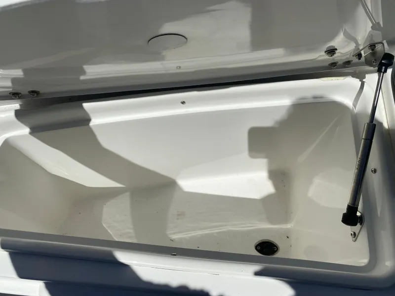 Slide: The Image of Open storage compartment of 2021 Walker Bay Generation 525 DLX boat. - 44
