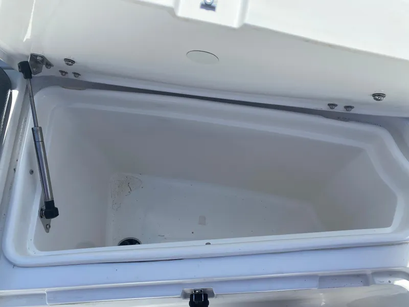 Slide: The Image of Open storage compartment in 2021 Walker Bay Generation 525 DLX boat. - 47