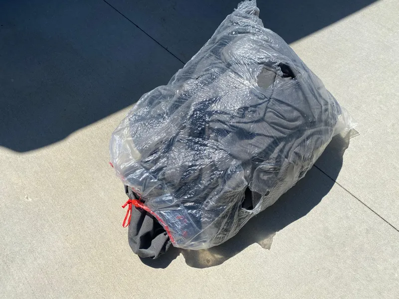 Slide: The Image of Plastic-wrapped bundle on concrete, possibly related to Walker Bay Generation 525 DLX, 2021 model. - 49