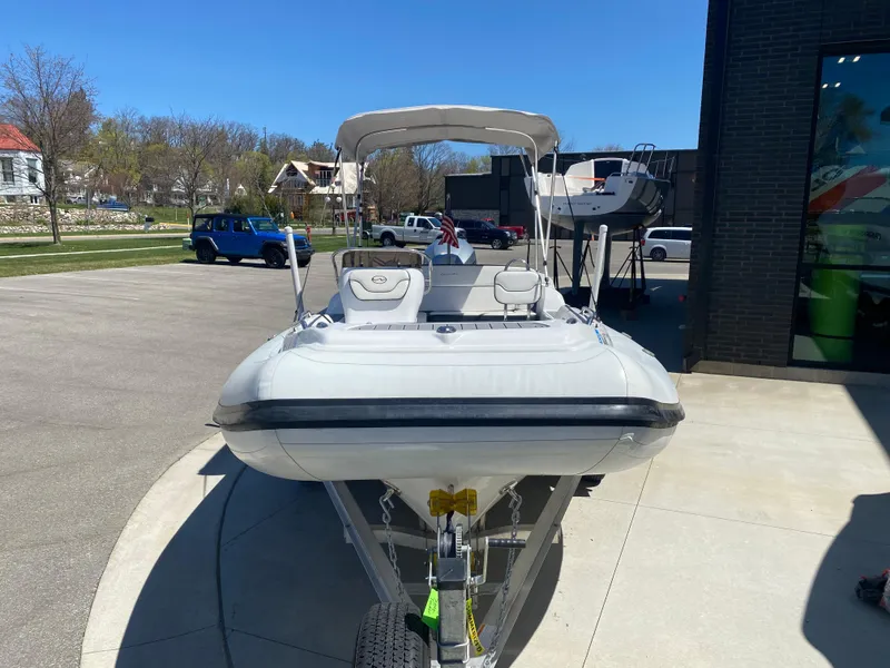 Slide: The Image of 2021 Walker Bay Generation 525 DLX boat on trailer, parked outdoors. - 6
