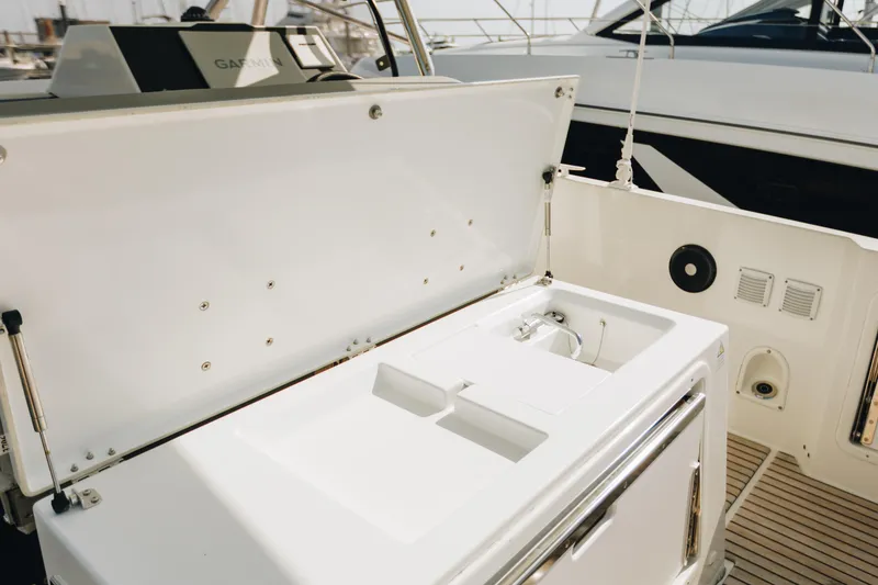 Slide: The Image of 2023 Beneteau Flyer 9 SPACEdeck boat with open storage compartment on deck. - 7