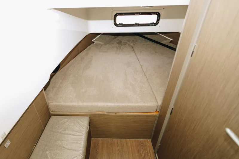 Slide: The Image of 2023 Beneteau Flyer 9 SPACEdeck cabin interior with bed and wooden finish. - 8