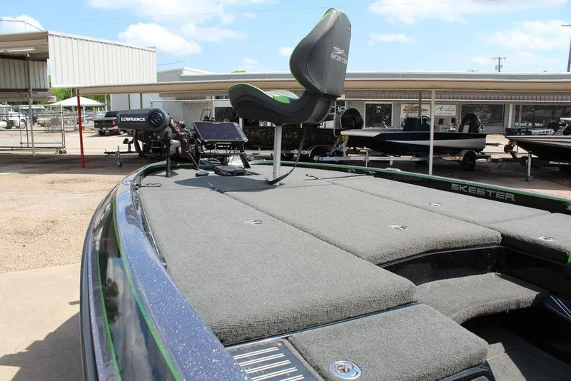 Slide: The Image of 2017 Skeeter FX20 LE fishing boat with elevated seat and equipment on deck. - 1