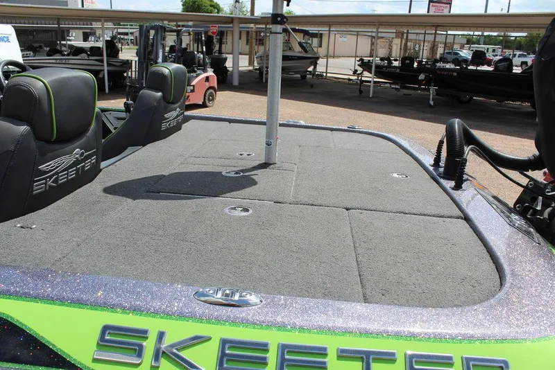 Slide: The Image of 2017 Skeeter FX20 LE boat deck with seating and storage compartments. - 2