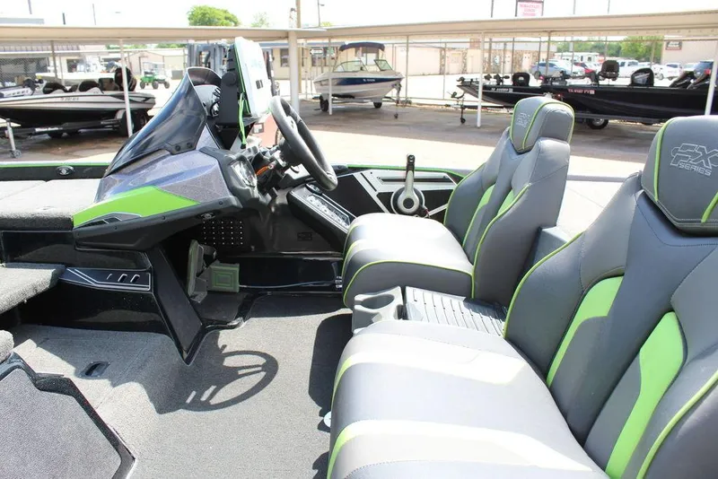 Slide: The Image of 2017 Skeeter FX20 LE boat interior with green-accented seats and modern dashboard. - 3