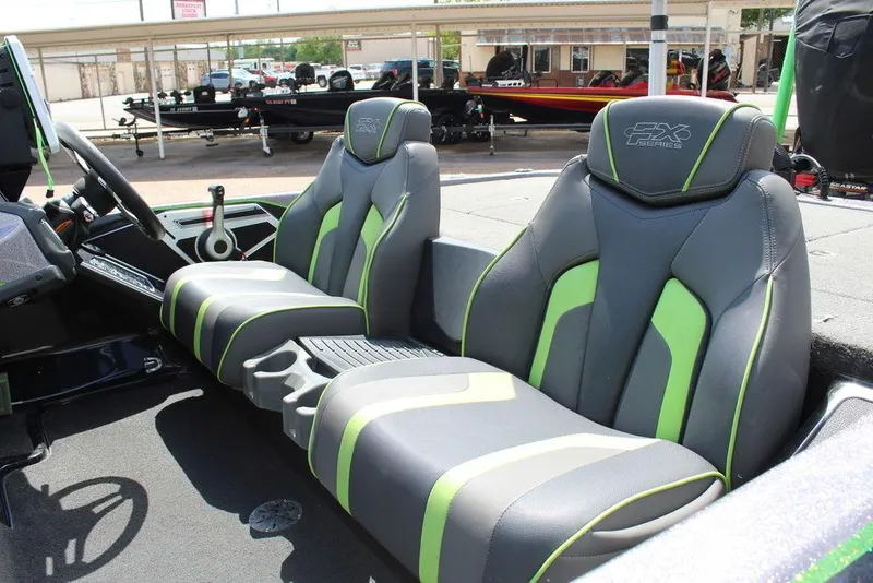 Slide: The Image of 2017 Skeeter FX20 LE boat interior with gray and green seats. - 4