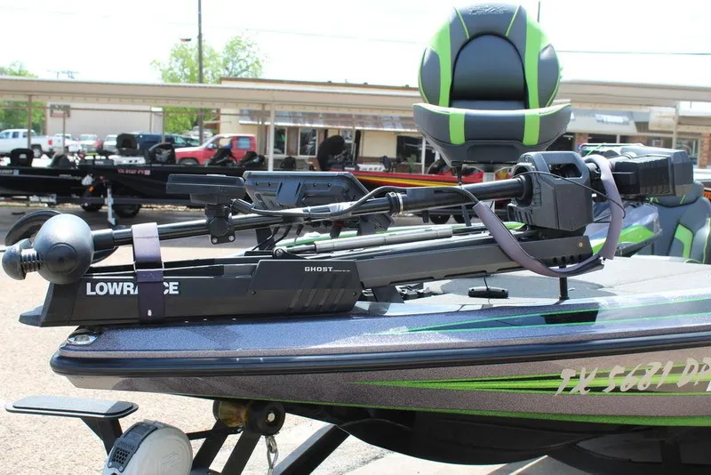 Slide: The Image of 2017 Skeeter FX20 LE boat with Lowrance Ghost trolling motor, parked outdoors. - 5