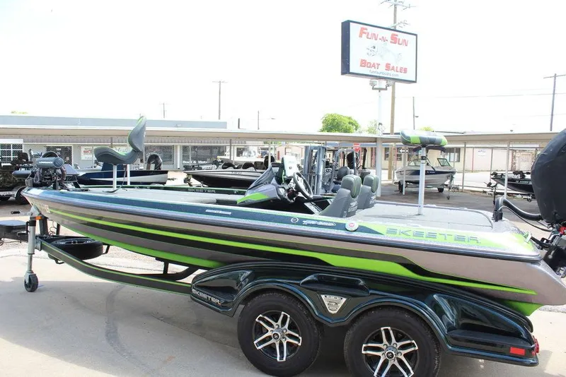 Slide: The Image of 2017 Skeeter FX20 LE boat displayed at dealership, featuring sleek design and vibrant accents. - 7
