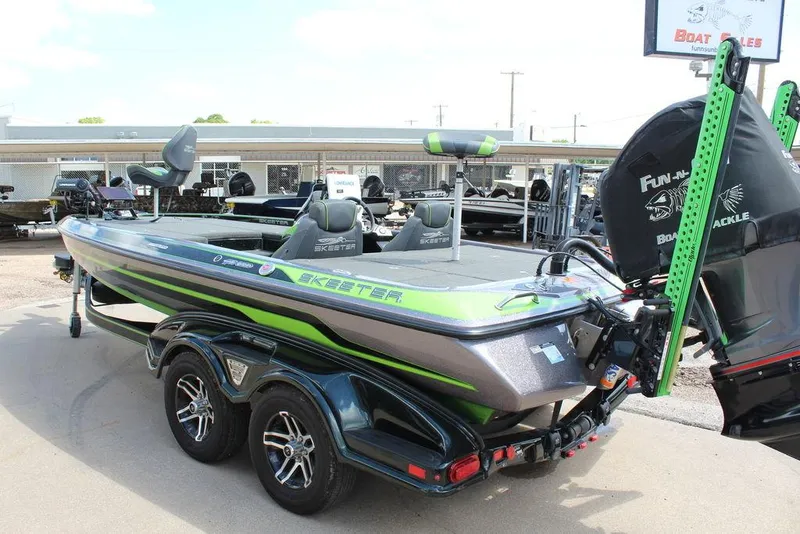 Slide: The Image of 2017 Skeeter FX20 LE bass boat with dual seats and outboard motor. - 8