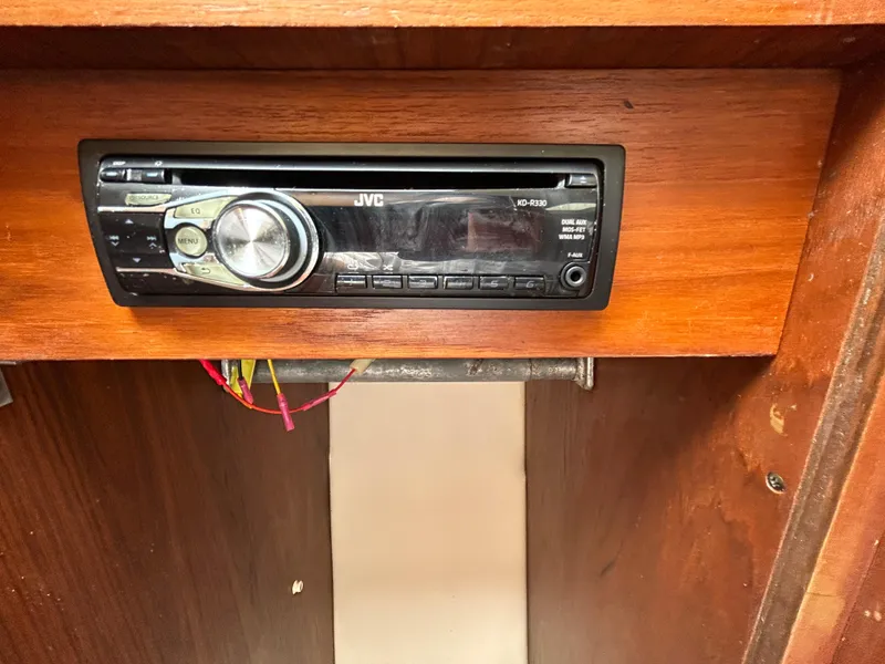 Slide: The Image of JVC stereo system in 1999 Tiara Yachts 400 Express, wooden panel background. - 26