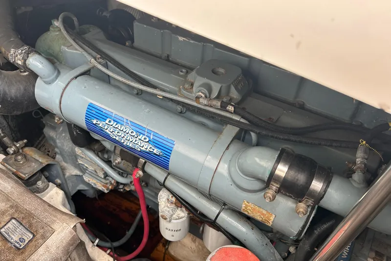 Slide: The Image of Engine compartment of a 1999 Tiara Yachts 400 Express, featuring a Diamond Performance component. - 39