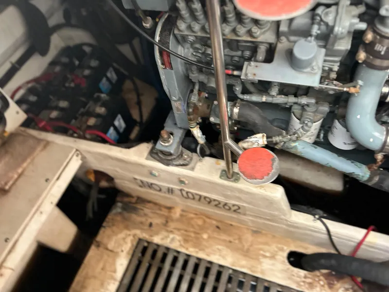 Slide: The Image of Engine compartment of a 1999 Tiara Yachts 400 Express, showing mechanical components and serial number. - 4