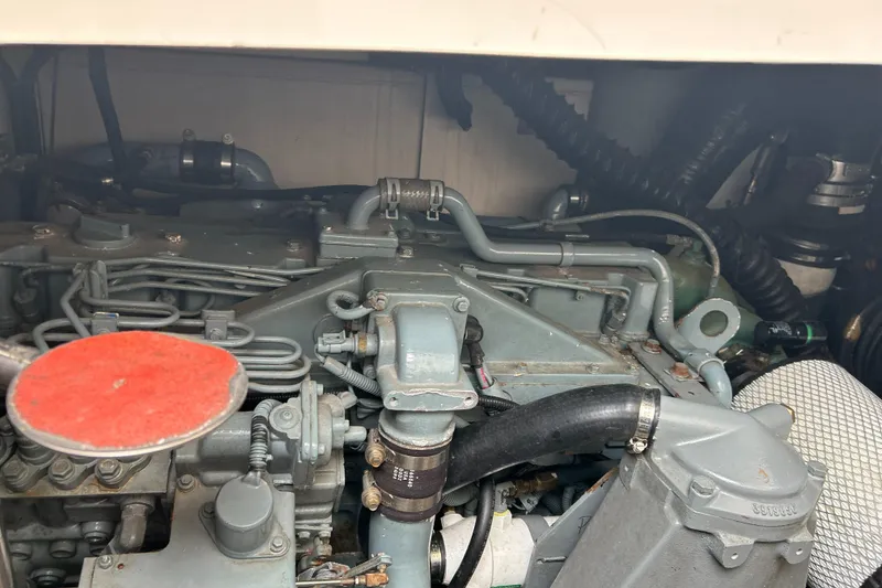 Slide: The Image of Engine compartment of a 1999 Tiara Yachts 400 Express, showcasing mechanical components. - 40