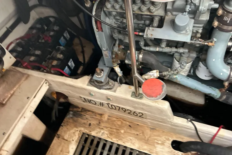 Slide: The Image of Engine compartment of a 1999 Tiara Yachts 400 Express, showing machinery and serial number. - 41