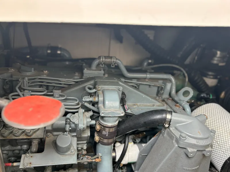 Slide: The Image of Engine compartment of a 1999 Tiara Yachts 400 Express, showcasing mechanical components. - 5