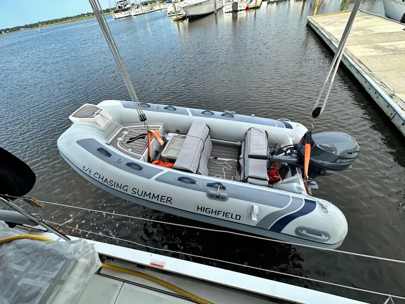 Slide: The Image of Highfield inflatable boat named "Chasing Summer" docked near a Beneteau Oceanis 46.1, 2023 model. - 17