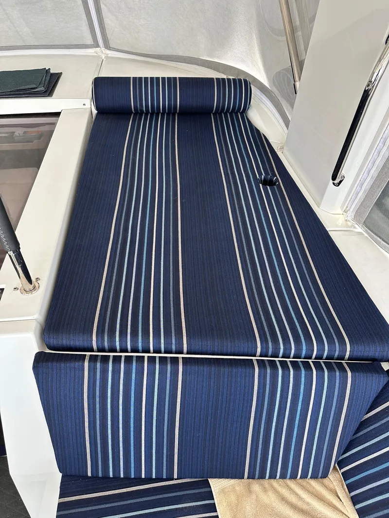 Slide: The Image of Blue striped seating on 2023 Beneteau Oceanis 46.1 yacht deck. - 28