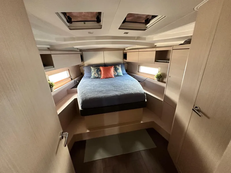 Slide: The Image of Luxurious cabin interior of 2023 Beneteau Oceanis 46.1 yacht with cozy bed and modern design. - 39