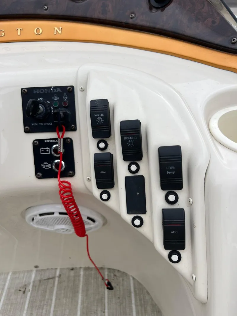 Slide: The Image of Control panel of a 2004 Bennington 2575 RLX boat with switches and speaker. - 11