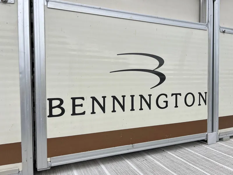 Slide: The Image of Bennington 2575 RLX 2004 boat panel with logo and design details. - 14