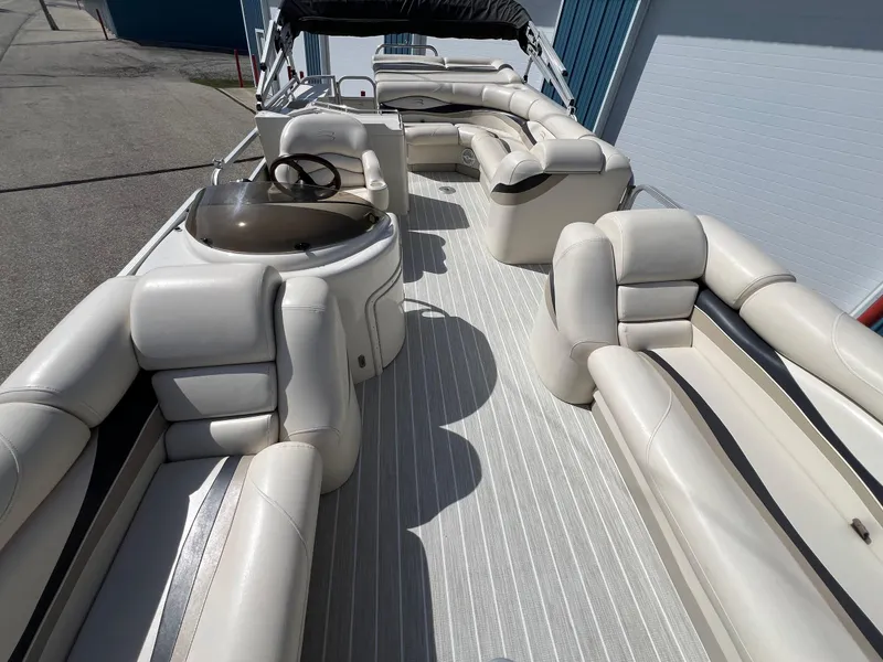 Slide: The Image of 2004 Bennington 2575 RLX pontoon boat with spacious seating and sleek design. - 2