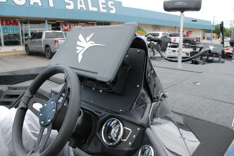 Slide: The Image of Steering console of 2025 Skeeter ZXR19 boat at dealership, featuring modern controls and display. - 4