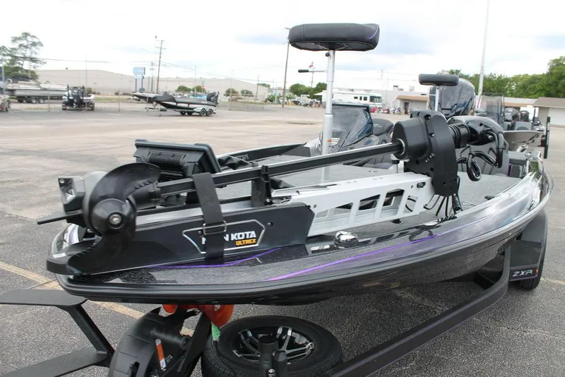 Slide: The Image of 2025 Skeeter ZXR19 boat with advanced trolling motor in a parking lot. - 6