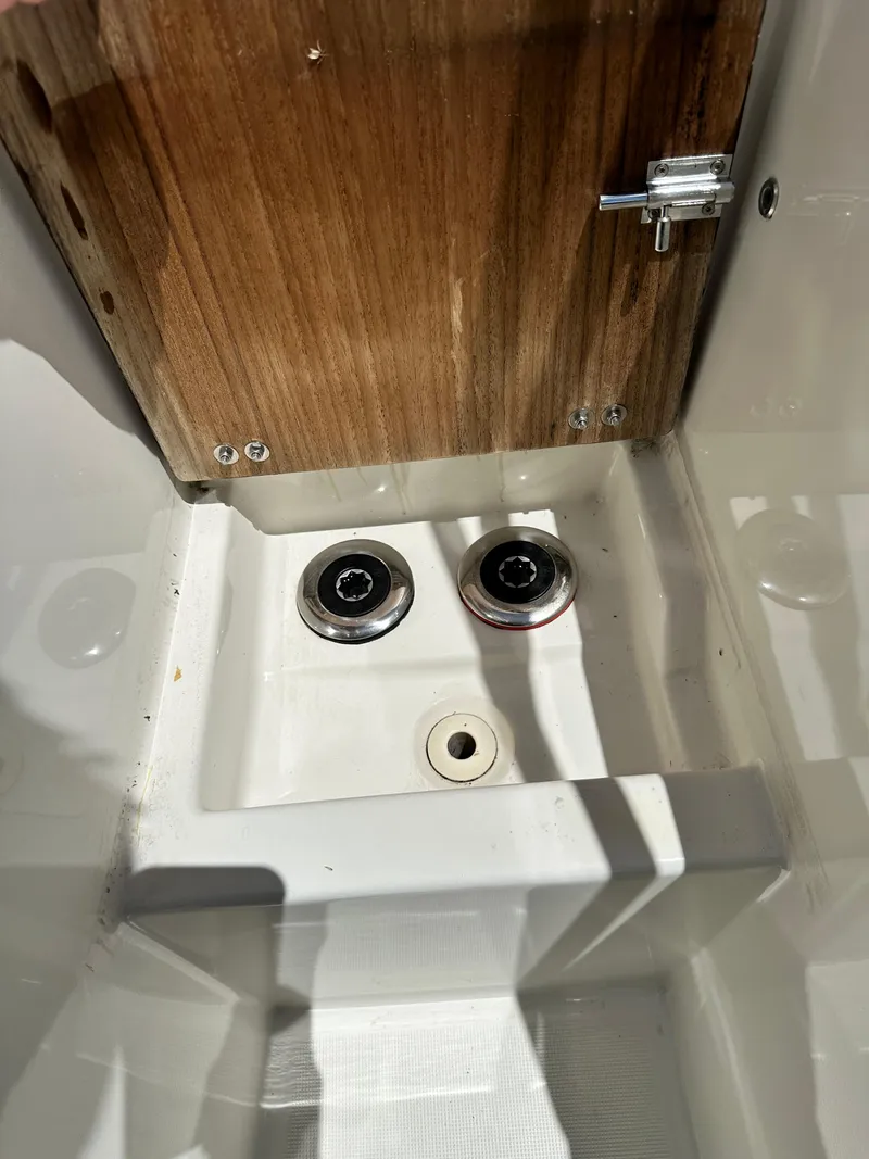 Slide: The Image of Interior detail of a 2022 Beneteau Swift Trawler 35, featuring wooden panel and fixtures. - 21