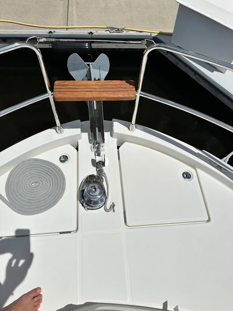 Slide: The Image of Bow of 2022 Beneteau Swift Trawler 35 with anchor and deck details. - 22