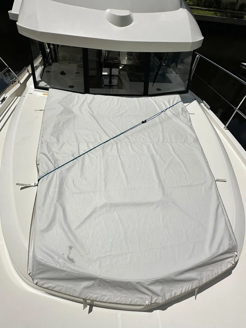 Slide: The Image of 2022 Beneteau Swift Trawler 35 deck with protective cover. - 25