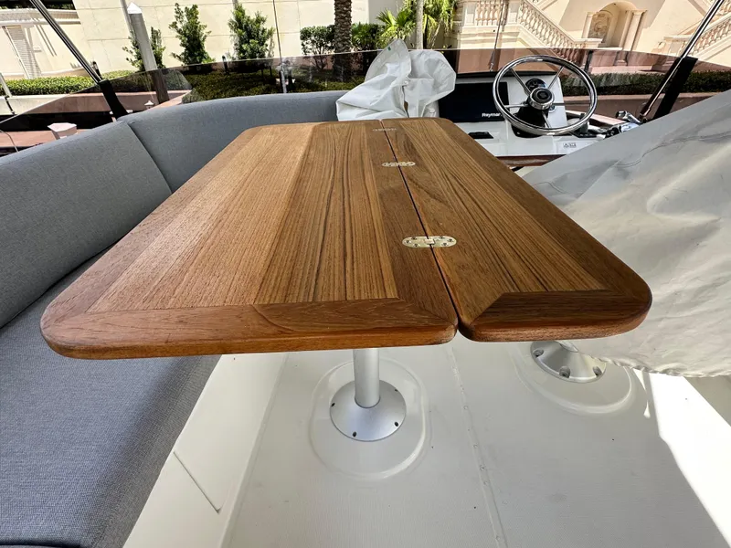 Slide: The Image of Wooden table and seating area on 2022 Beneteau Swift Trawler 35 yacht. - 31