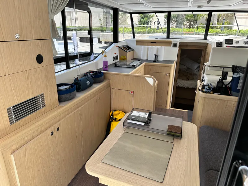 Slide: The Image of Interior of 2022 Beneteau Swift Trawler 35, featuring modern wood cabinetry and spacious layout. - 41