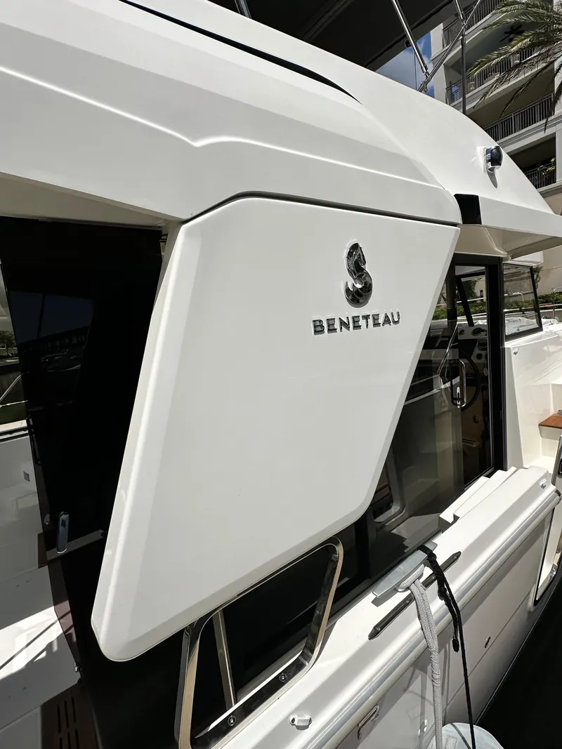 Slide: The Image of 2022 Beneteau Swift Trawler 35, side view with open door and visible interior. - 9
