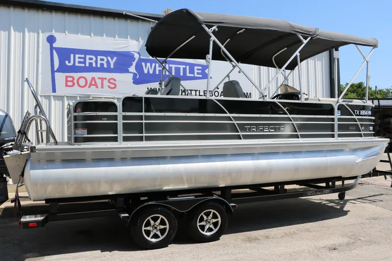 Slide: The Image of 2021 Trifecta 24 RFC pontoon boat on trailer at Jerry Whittle Boats dealership. - 11