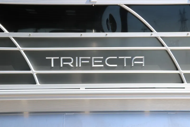 Slide: The Image of 2021 Trifecta 24 RFC boat logo on sleek metallic surface. - 12
